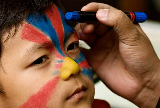 Tibetan flag on kid's face Tibetan flag on kid's face